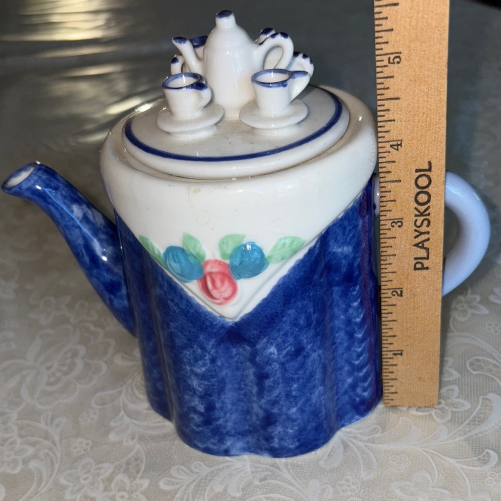 Blue and White porcelain Teapot with Floral Design $20